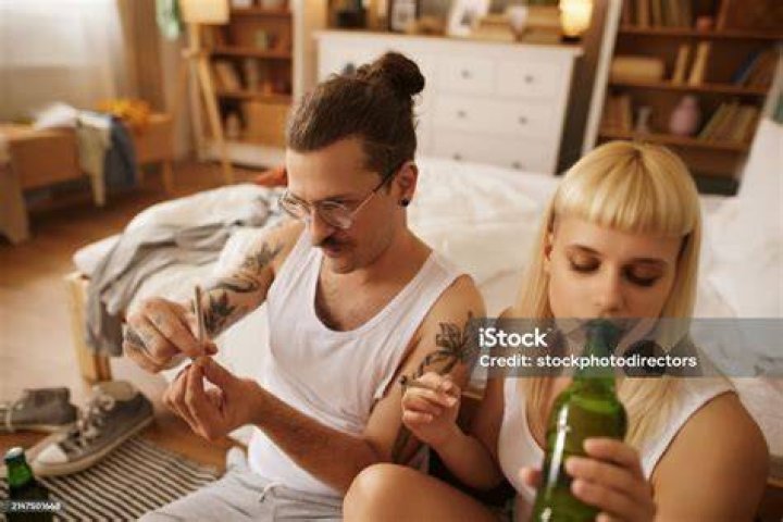 Couple Drinking And Smoking
