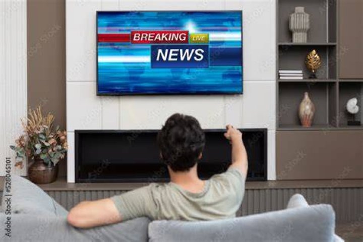 Man Watching Columbia Crash News
