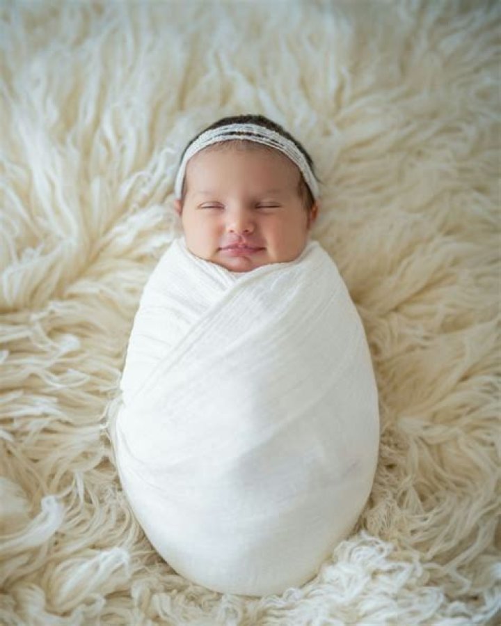 Newborn Wrapped In Blanket